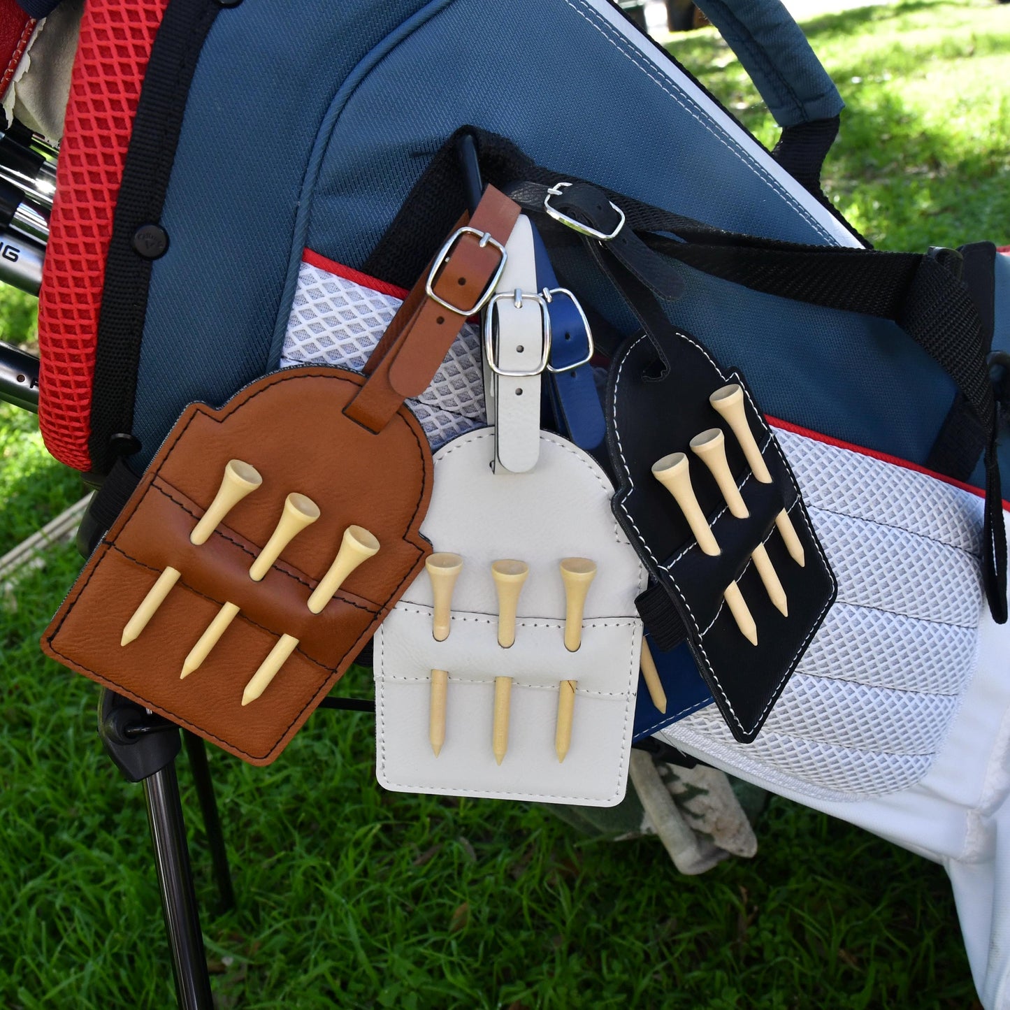 a close up of a golf bag with a bag tag attached to it