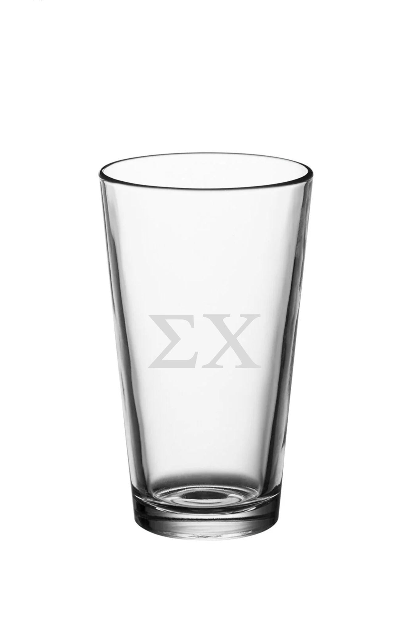 a shot glass with the letter x on it