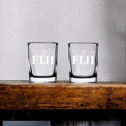 Phi Gamma Delta (FIJI) 2 oz shot glass with crisp laser engraving, showcasing FIJI letters, ideal for fraternity initiations, parties, and commemorations.