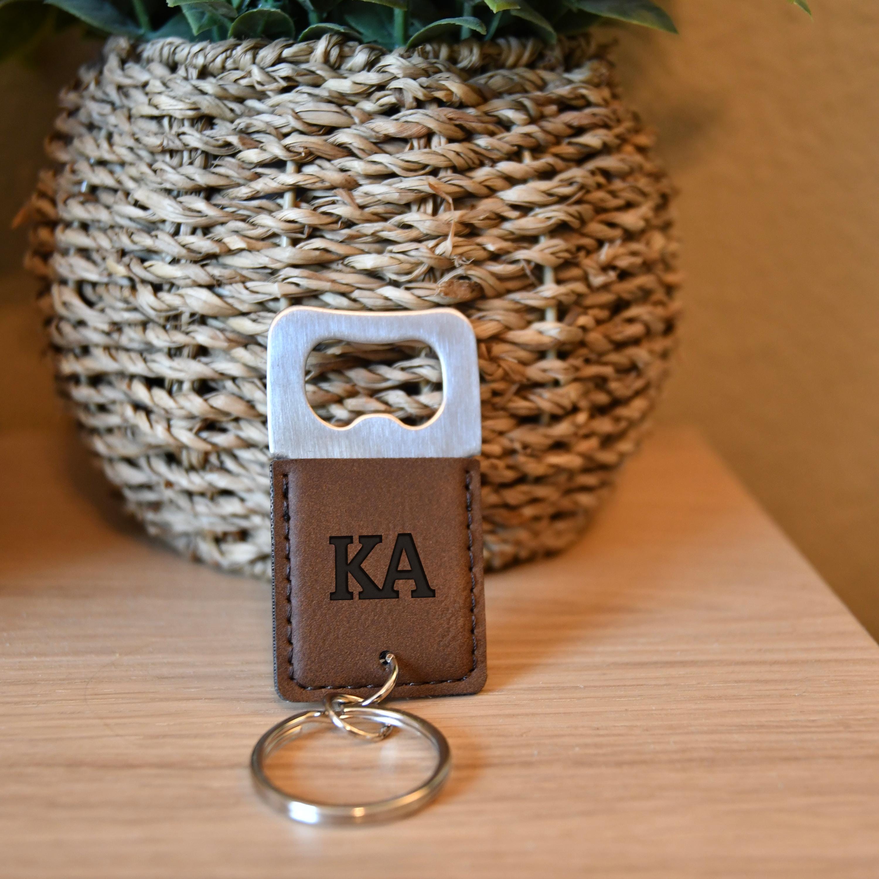 a keychain with a leather keyring attached to it
