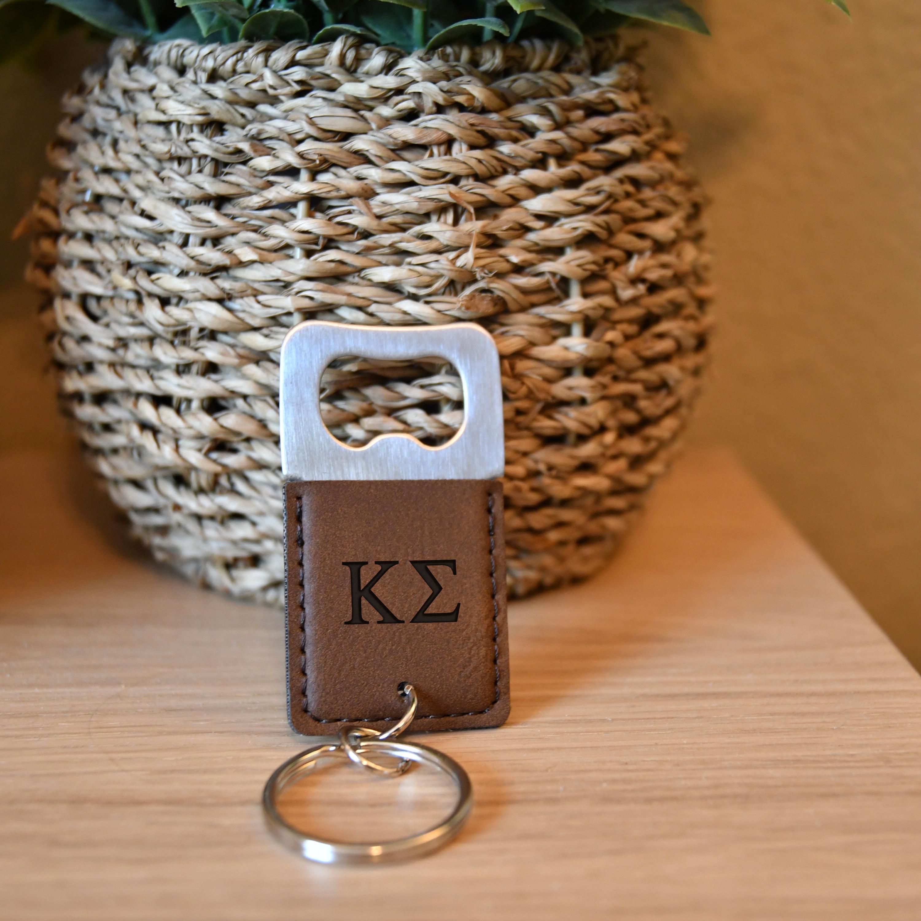 a keychain with a leather keyring attached to it