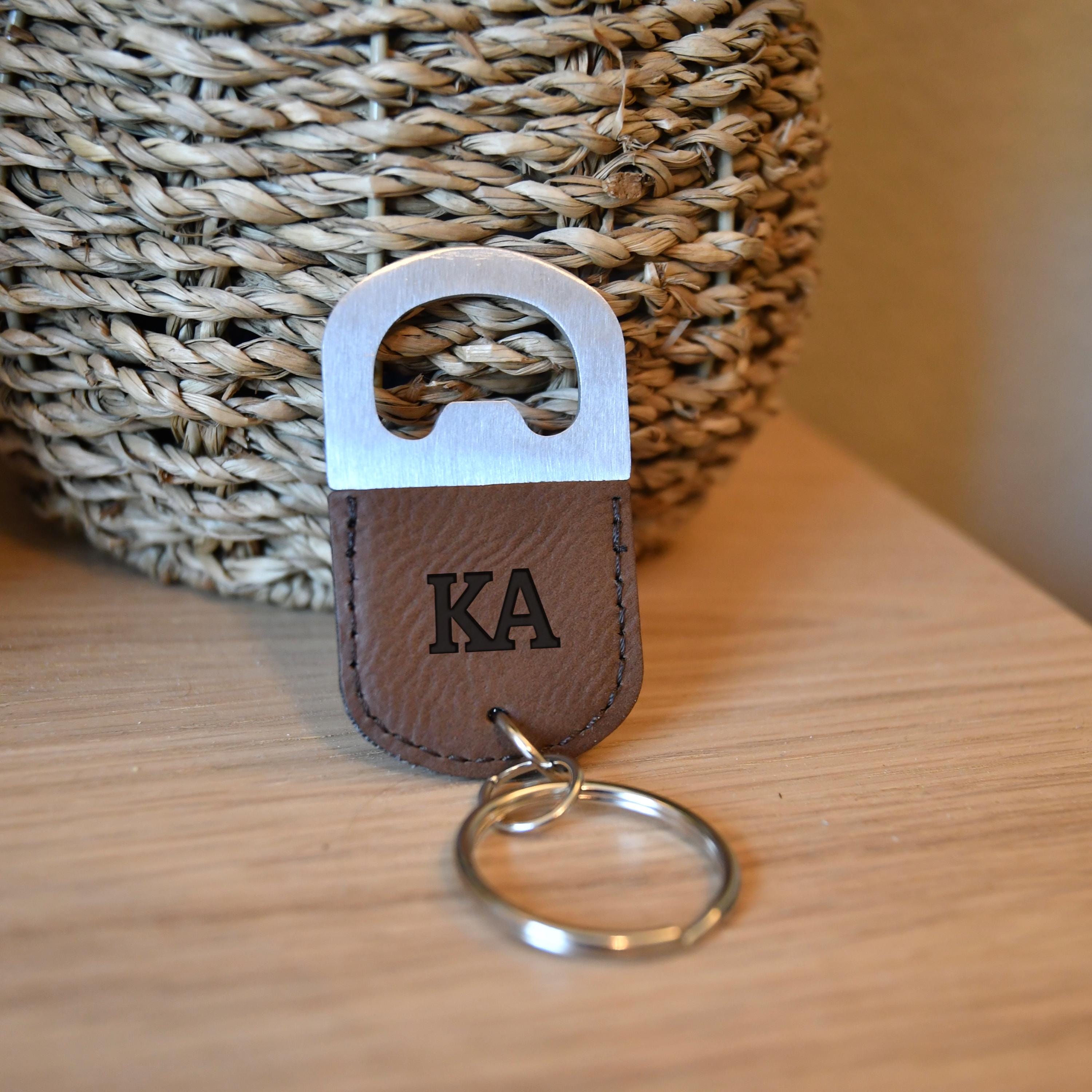 a keychain with a leather keyring attached to it