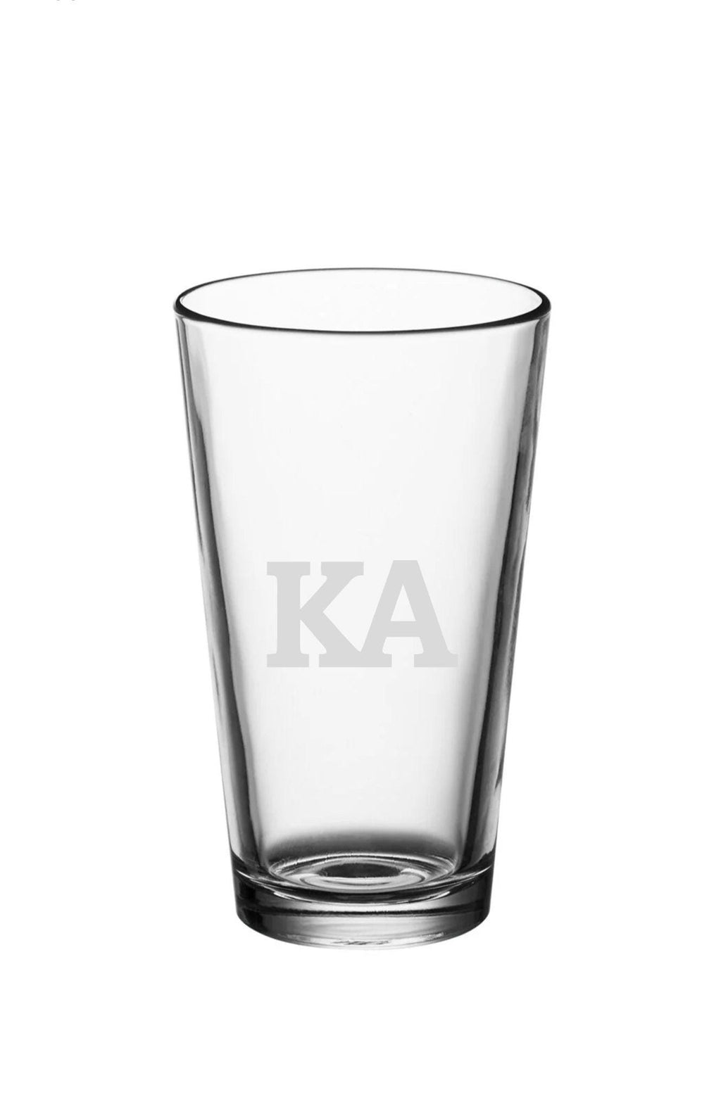 a shot glass with the letters k a on it
